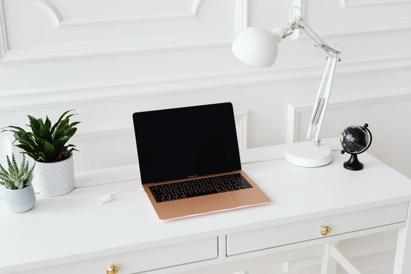A laptop on a clean workplace desk